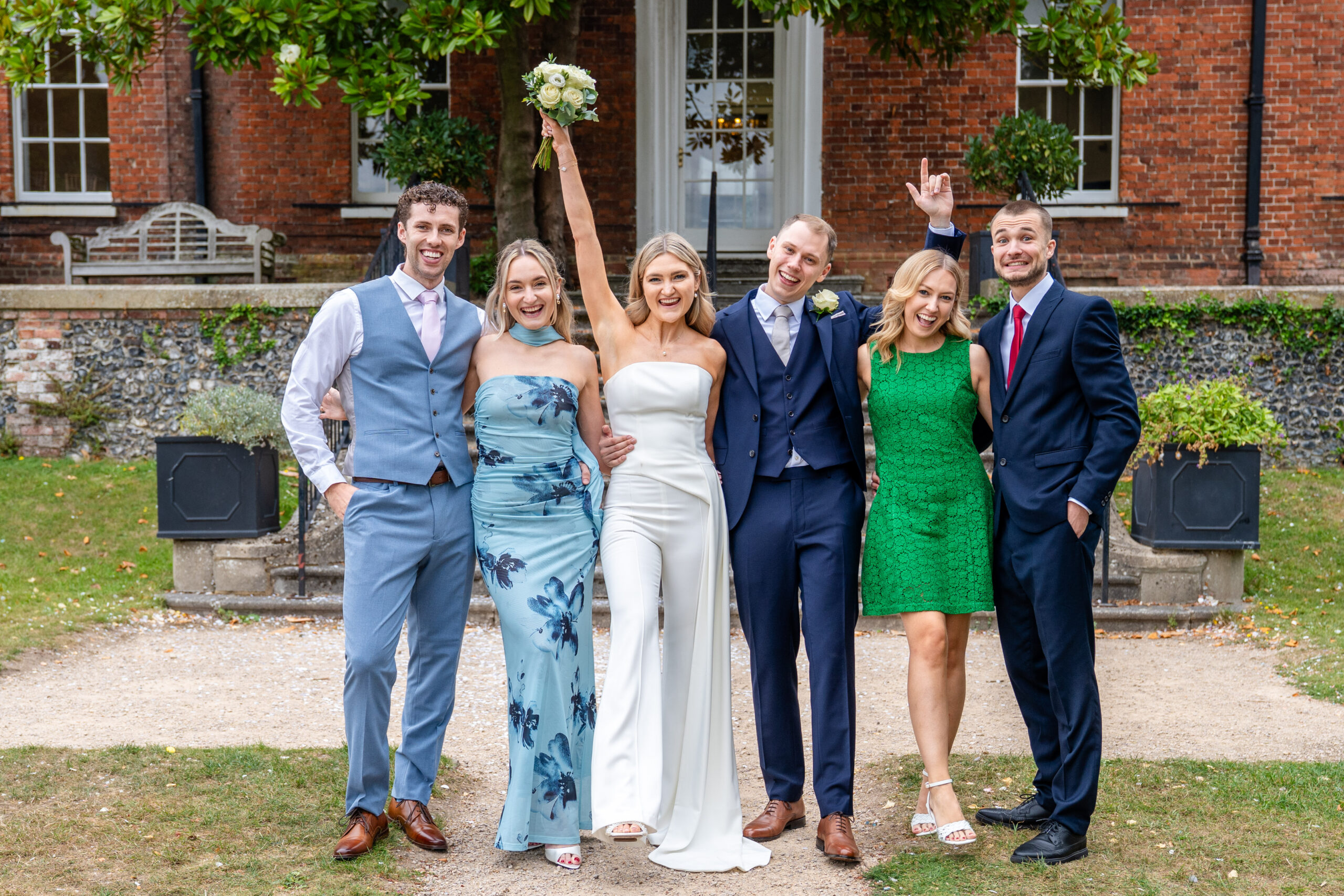 Fun and relaxed Large group photo on Leatherhead Register Office steps.