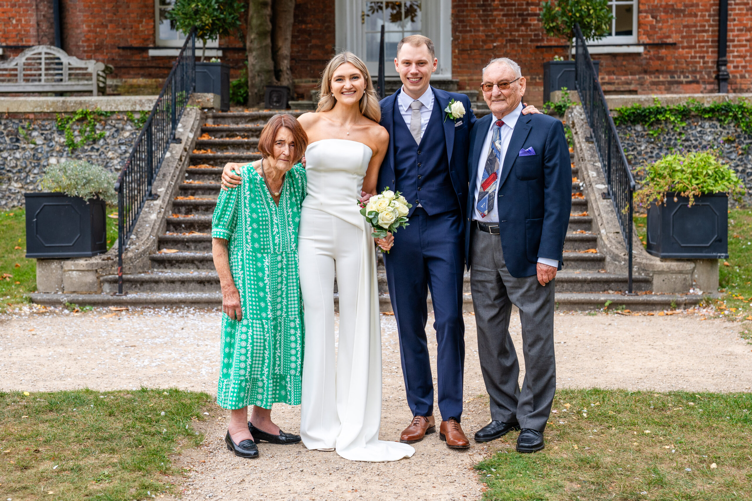 Family photo on the steps, Surrey registry office wedding photogrpaher