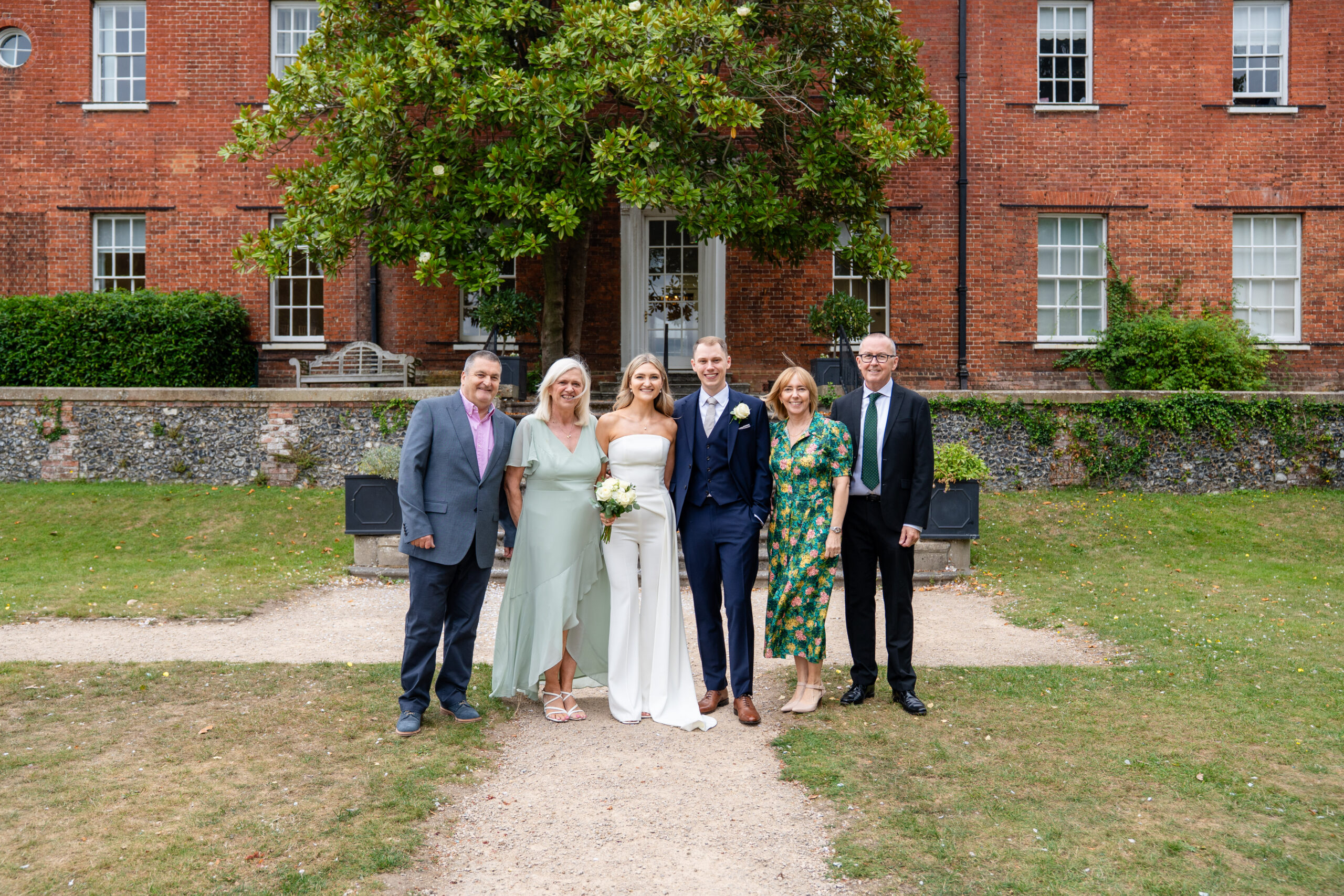 Family photo on the steps, Surrey registry office wedding photogrpaher