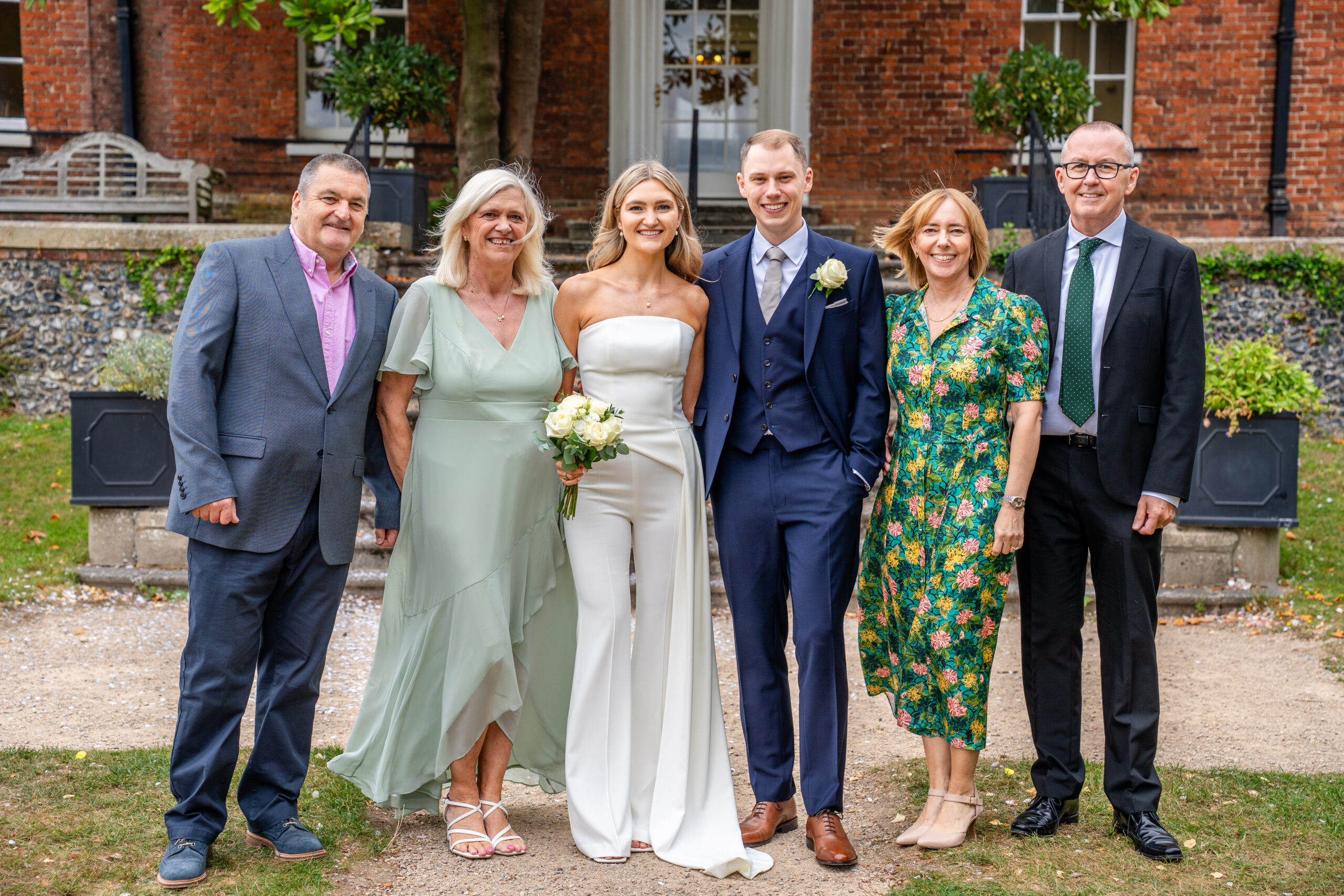 Family photo on the steps, Surrey registry office wedding photogrpaher