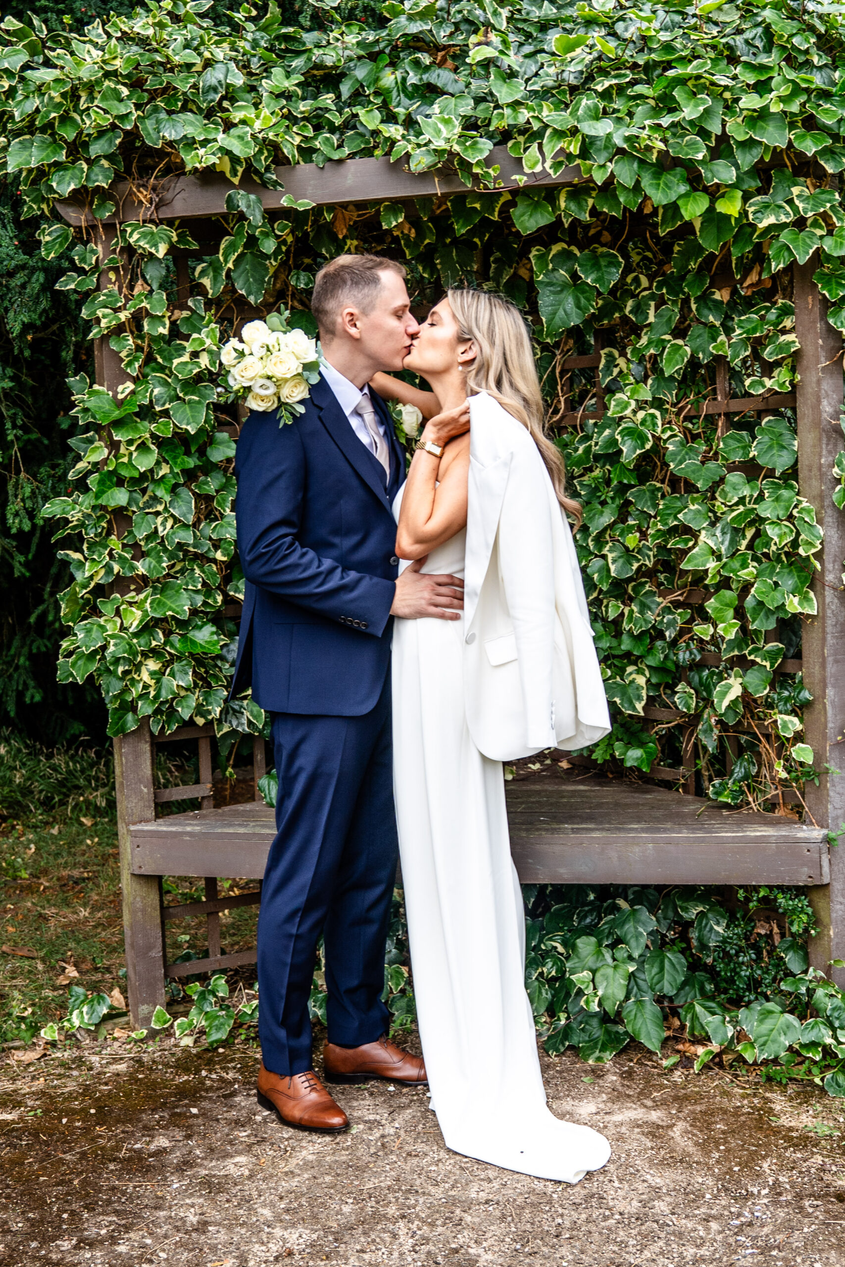 couple portraits in the gardens of Leatherhead registry office
