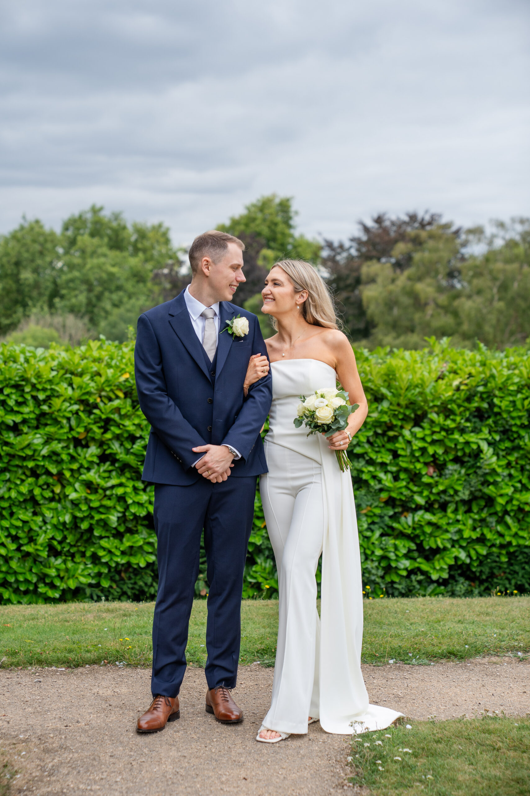 Candid moment between newlyweds in Surrey garden