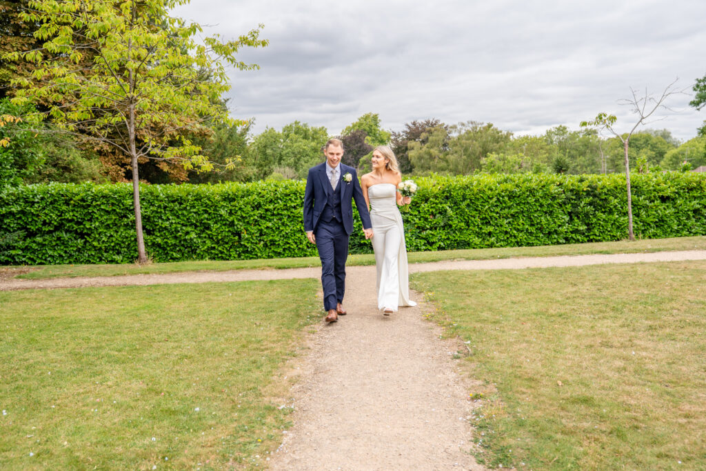 Relaxed and documentary couple portraits in the gardens of Leatherhead registry office