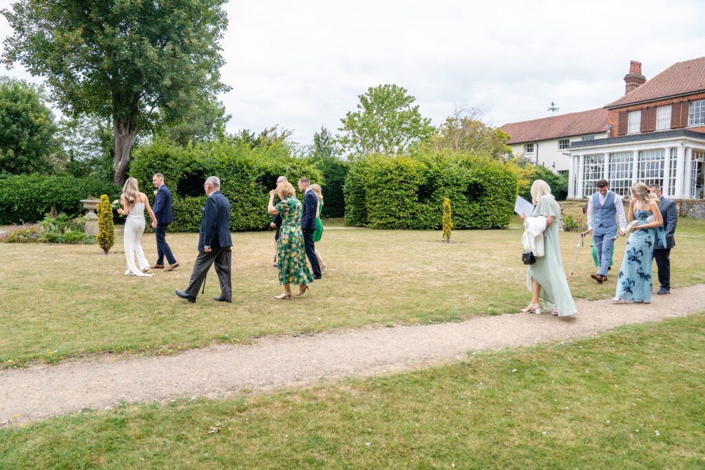 Guests leaving Leatherhead registry office captured by Surrey wedding photographer