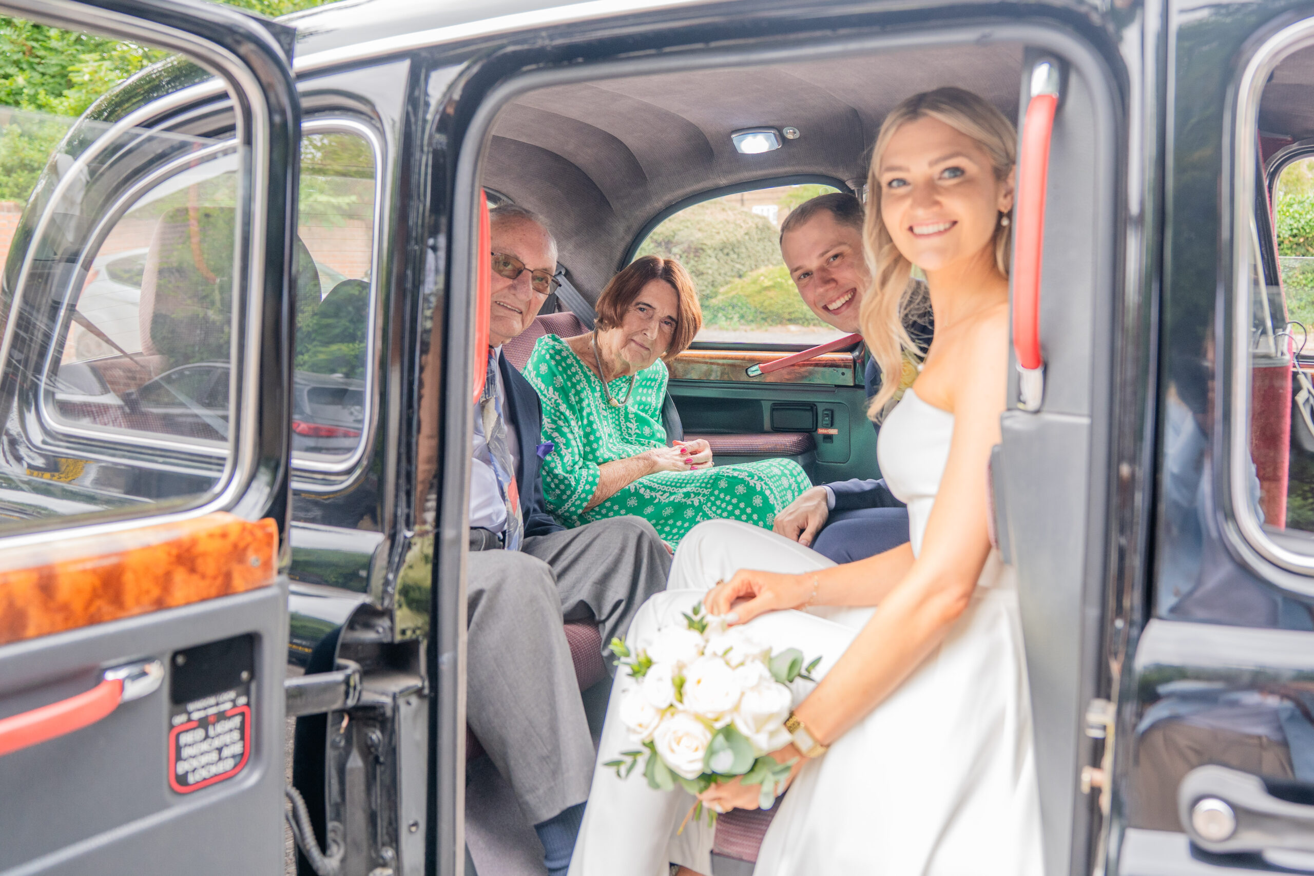 relaxed portraits leaving for the reception photographed by Surrey wedding photographer