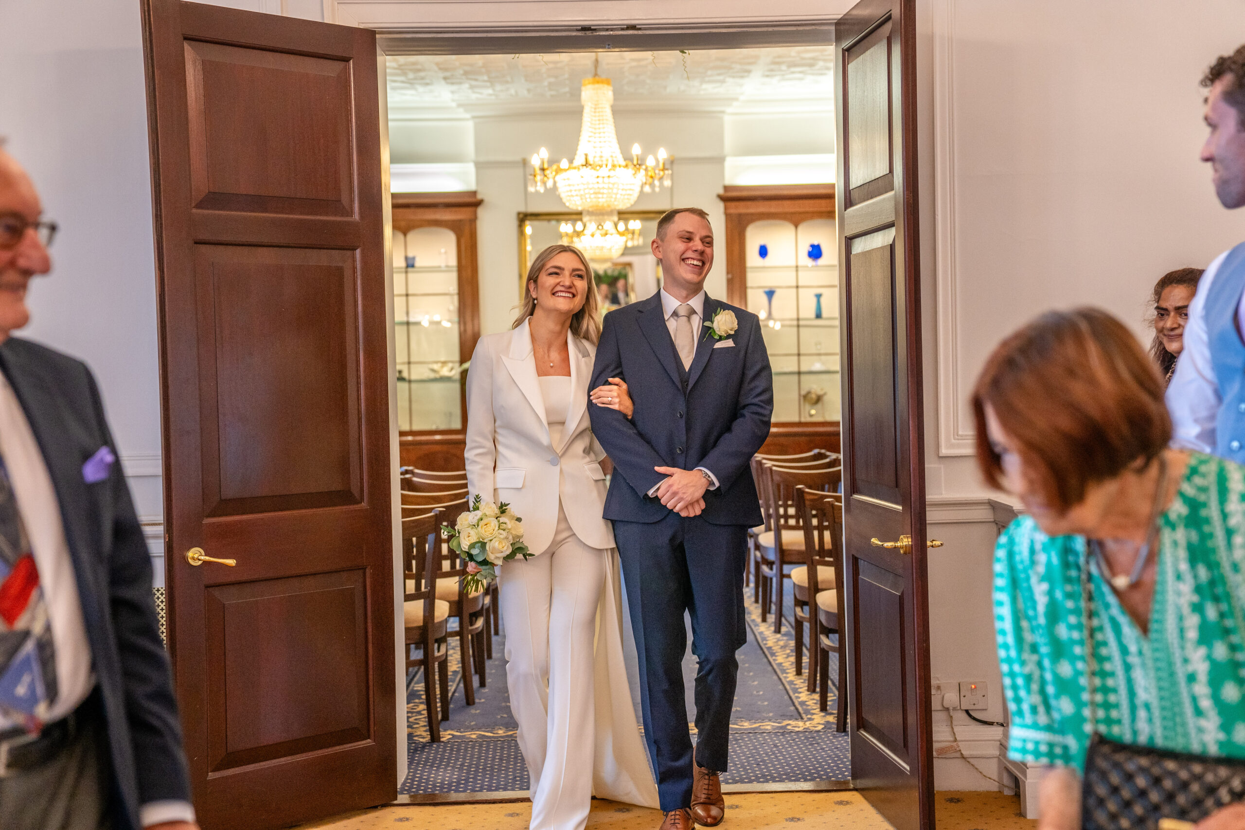 Bride and groom walking into the ceremony room
