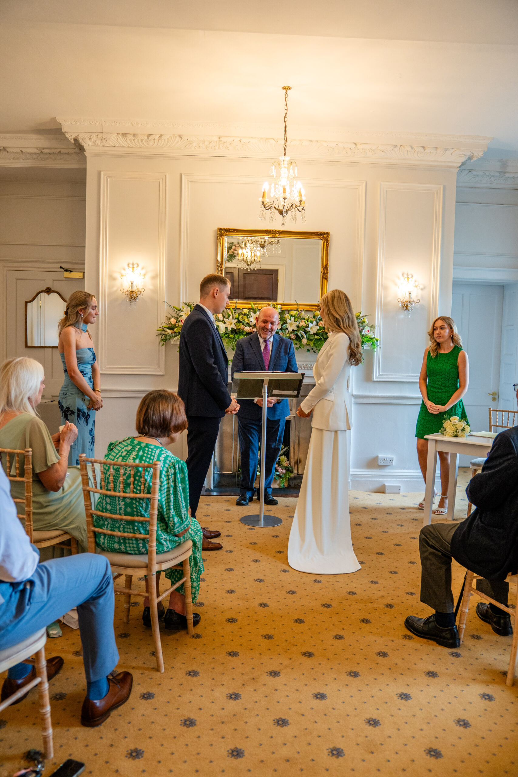 Couple exchanging vows in ceremony room