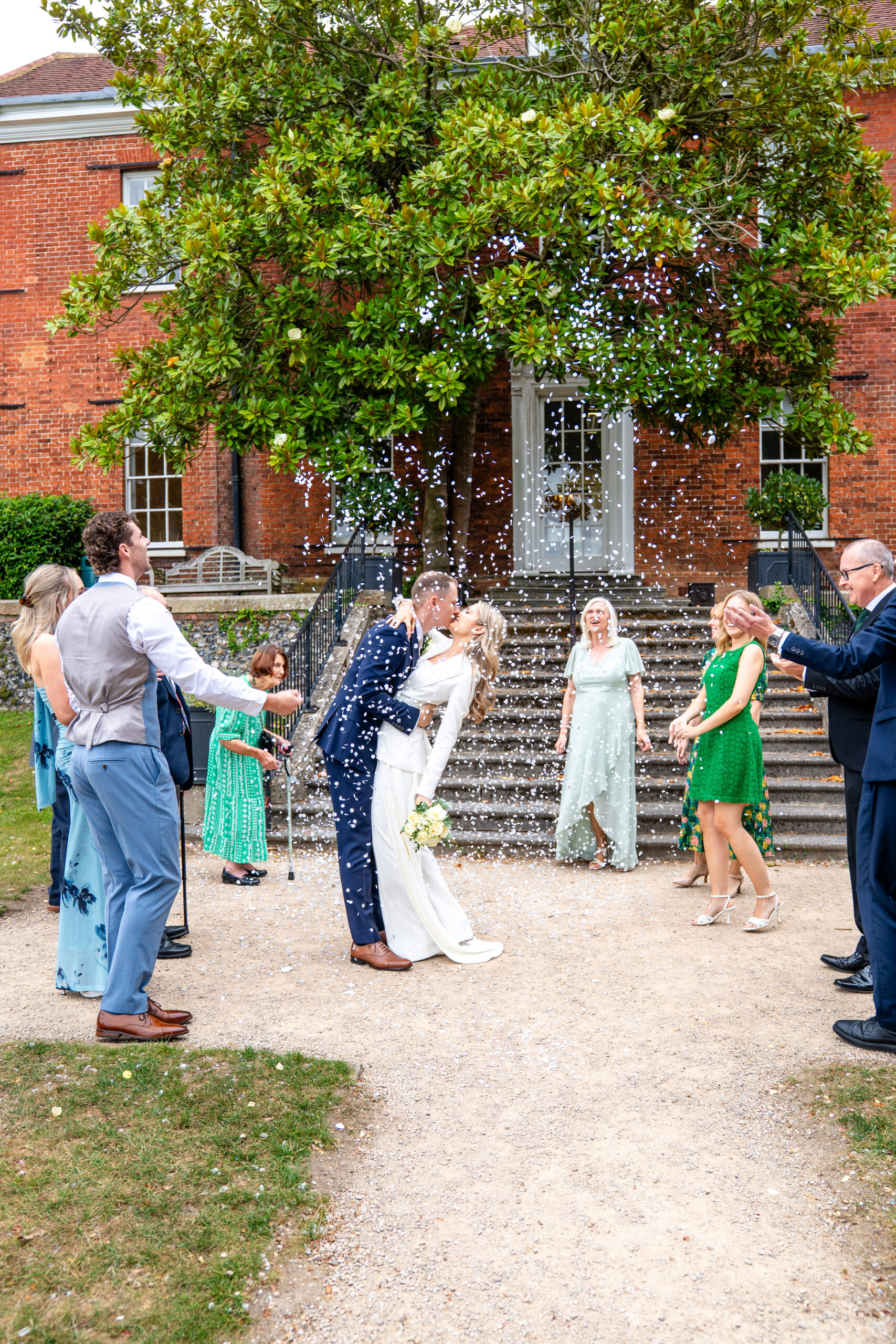 Confetti being thrown on the steps of The Mansion