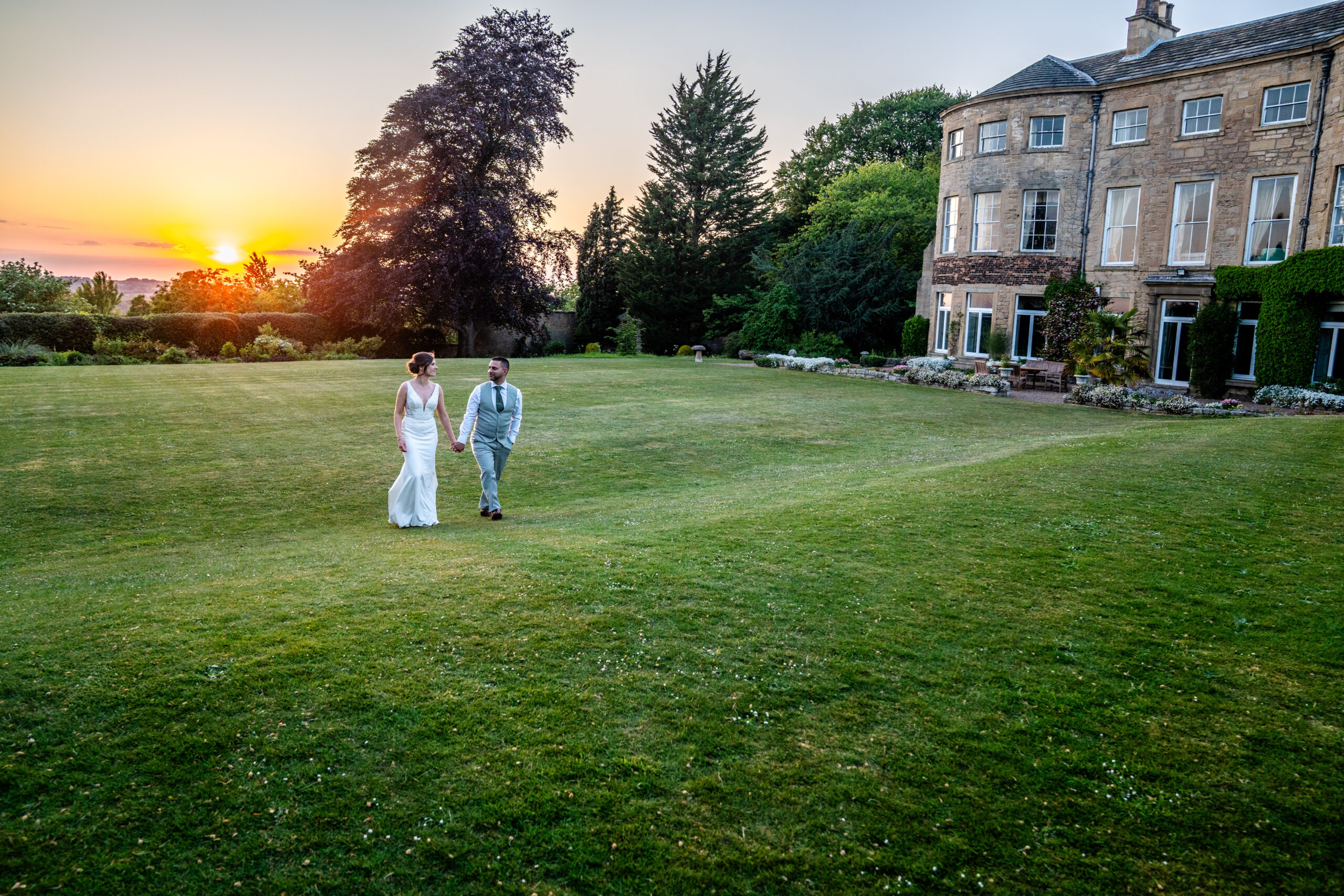 bride and groom portraits with sunsetting in the evening at South Yorkshire wedding venue