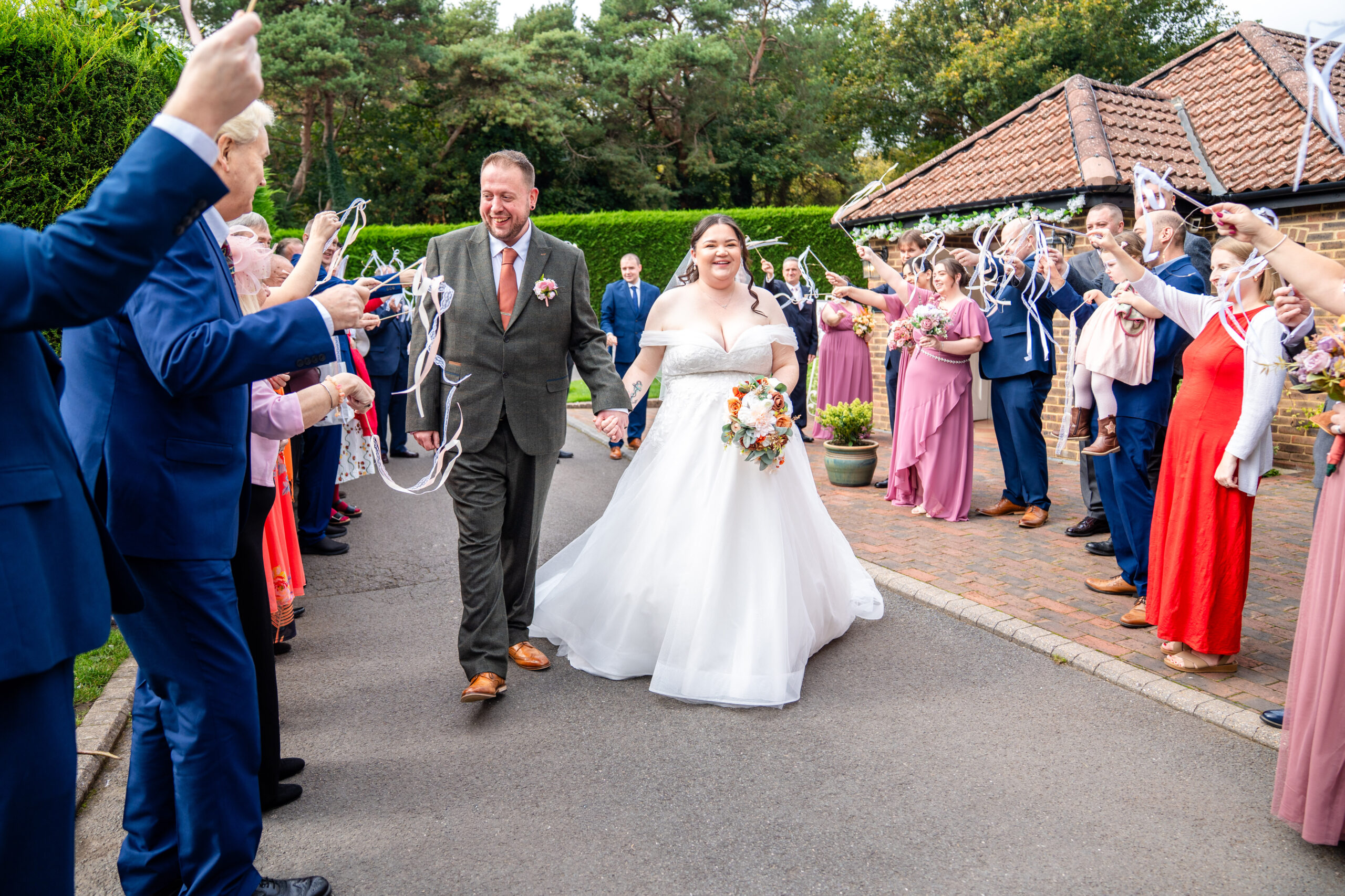 A beautiful unique wand exit at Oaks Farm captured by south London wedding photogapher