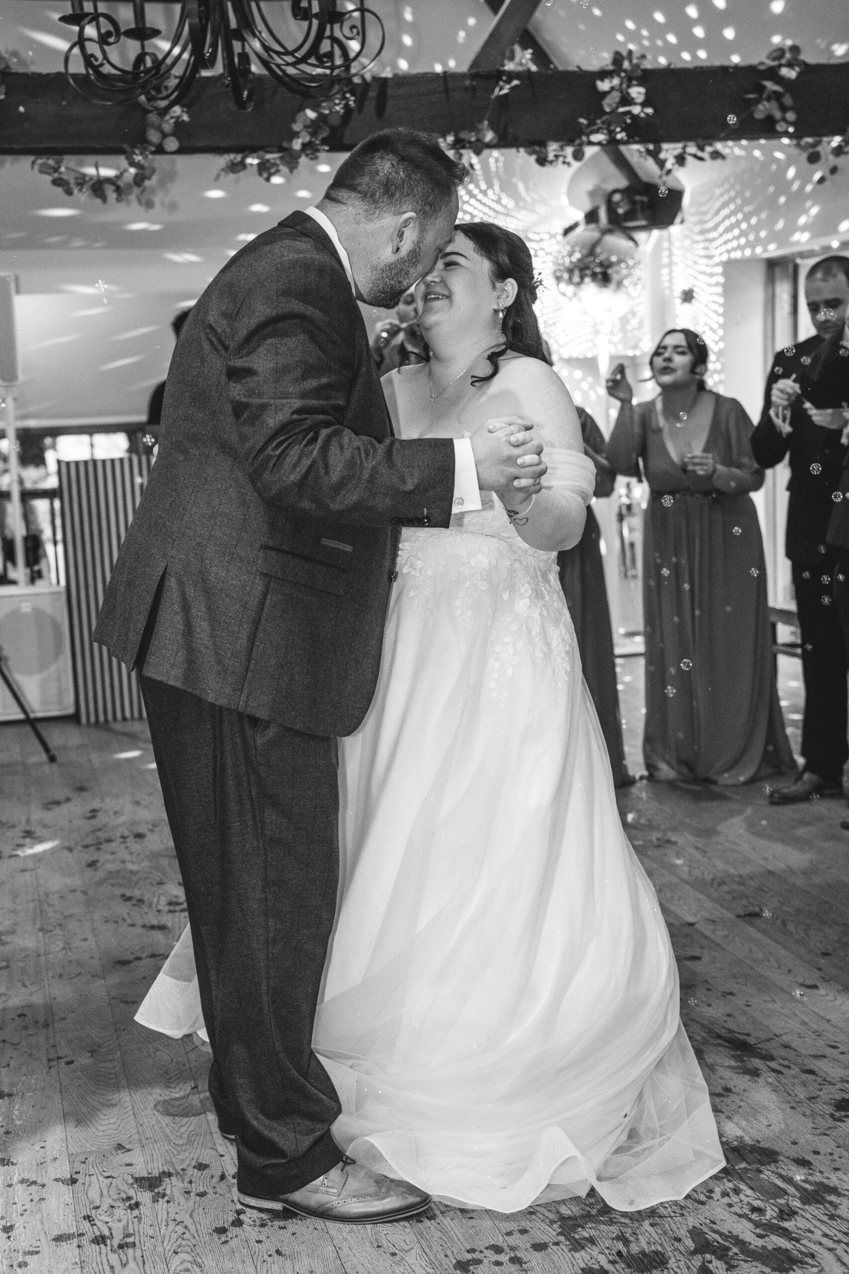 First dance surrounded by guests blowing bubbles