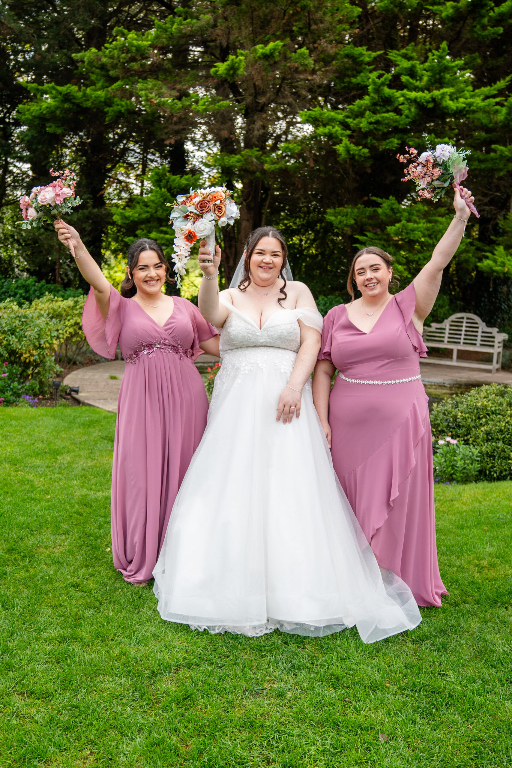 Bridal party group shot in autumn gardens 