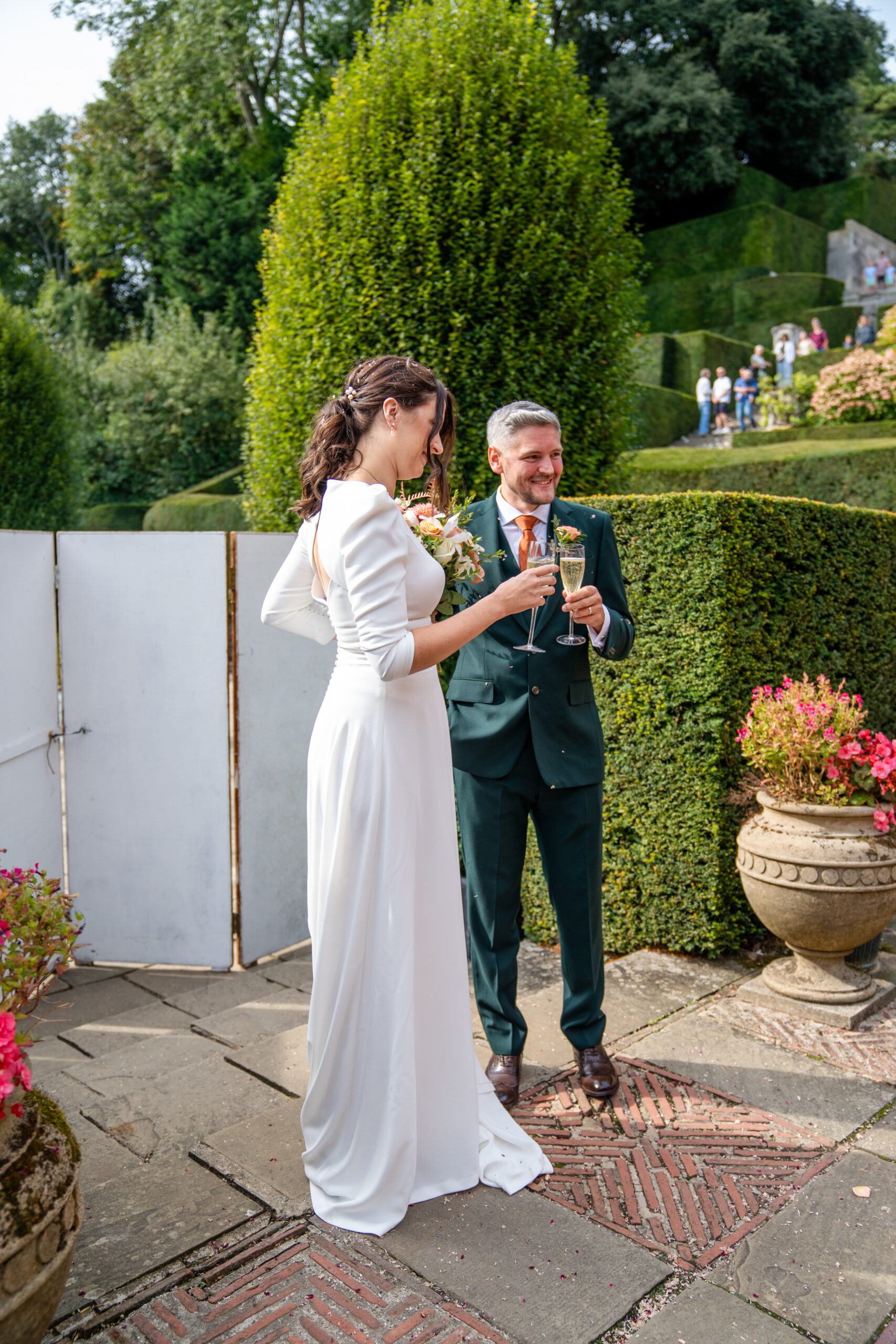 Bride and groom enjoying a quiet moment on the grounds of Port Lympne Hotel and Reserve, documentary-style wedding photography in kent