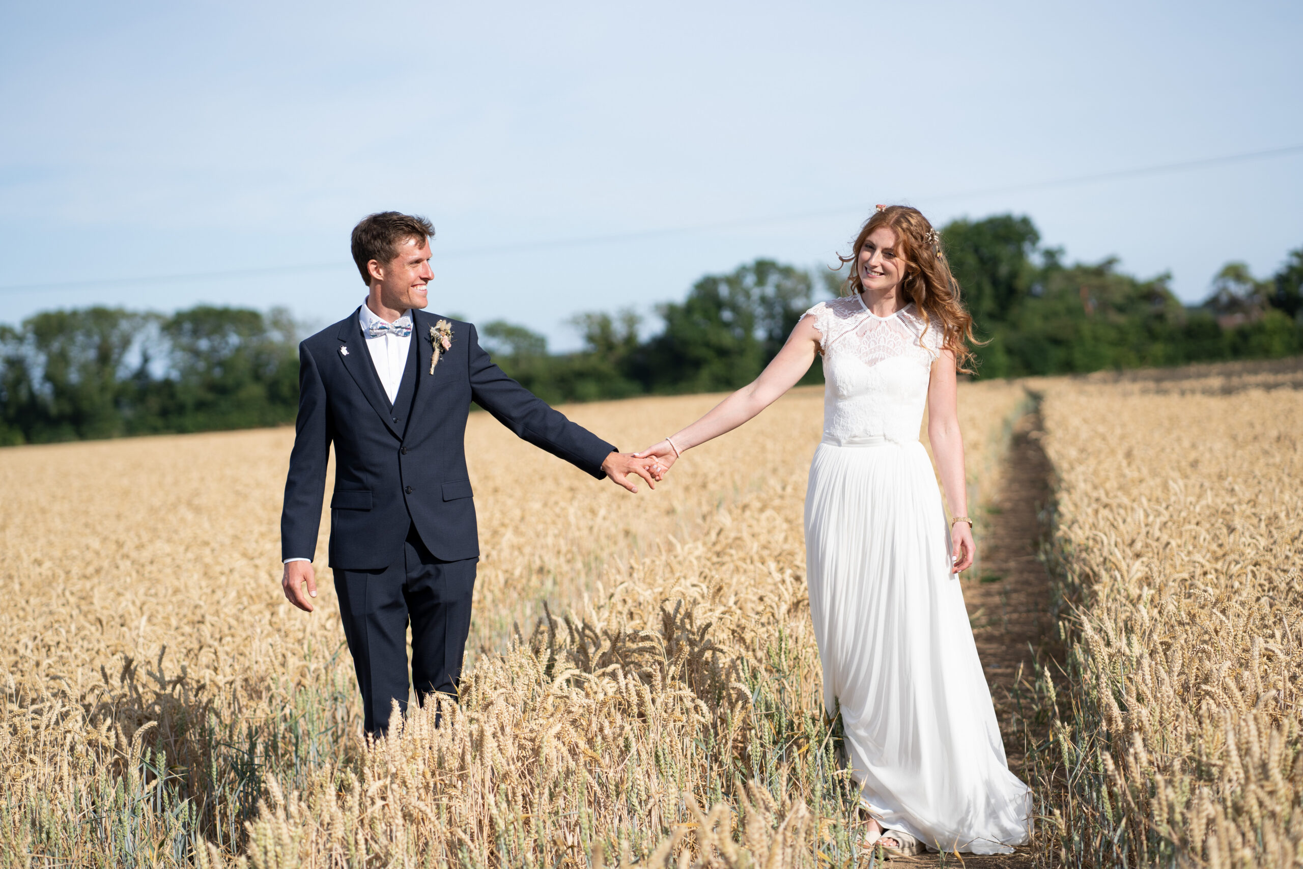 Relaxed wedding Photographer capturing bride and groom