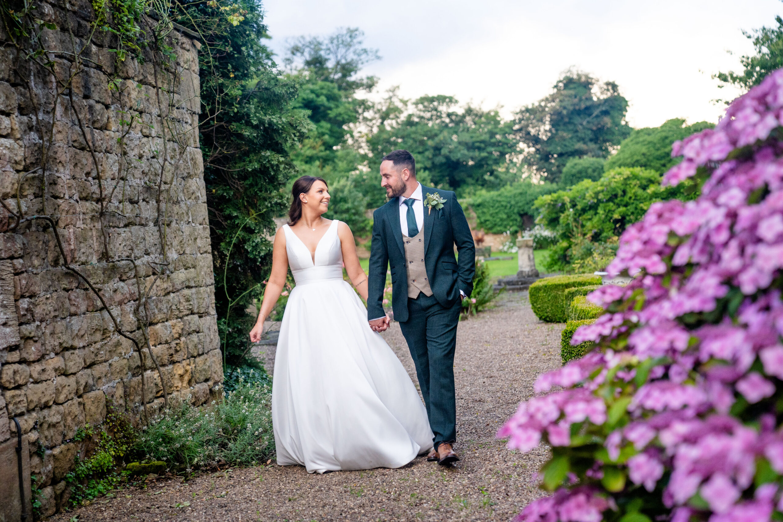 Relaxed documentary couple portraits in the garden of Hooton Pagnell Hall in South Yorkshire