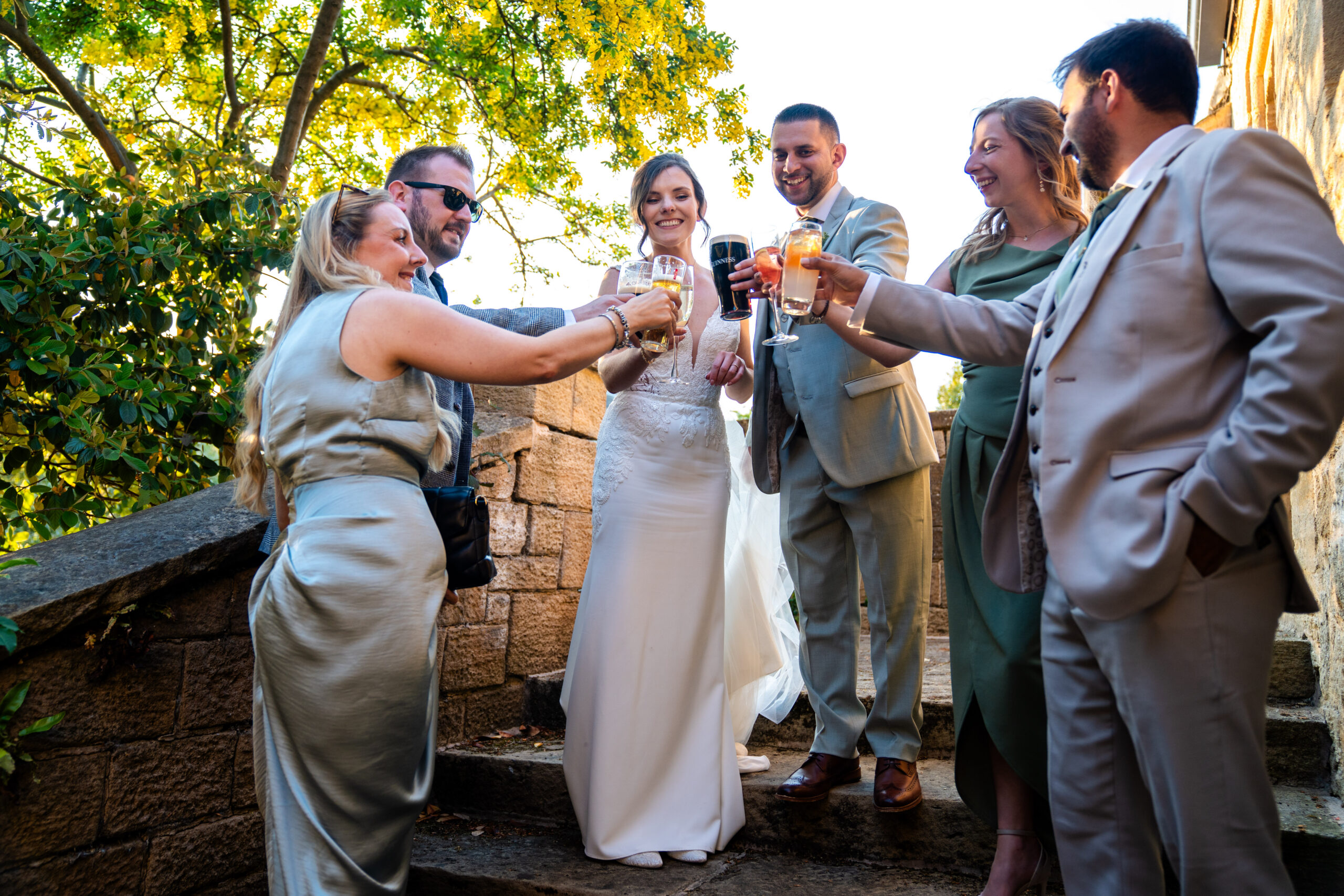 Candid moment of guests and bride and groom enjoying the outdoors
