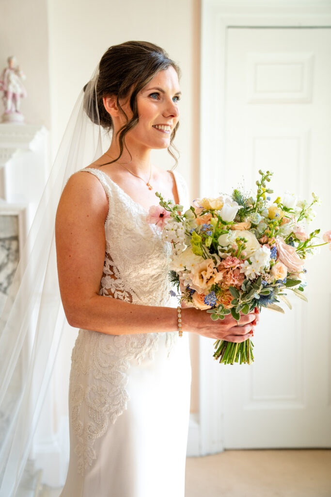 Bridal Portrait with bouquet taken by Hedsor House wedding photographer