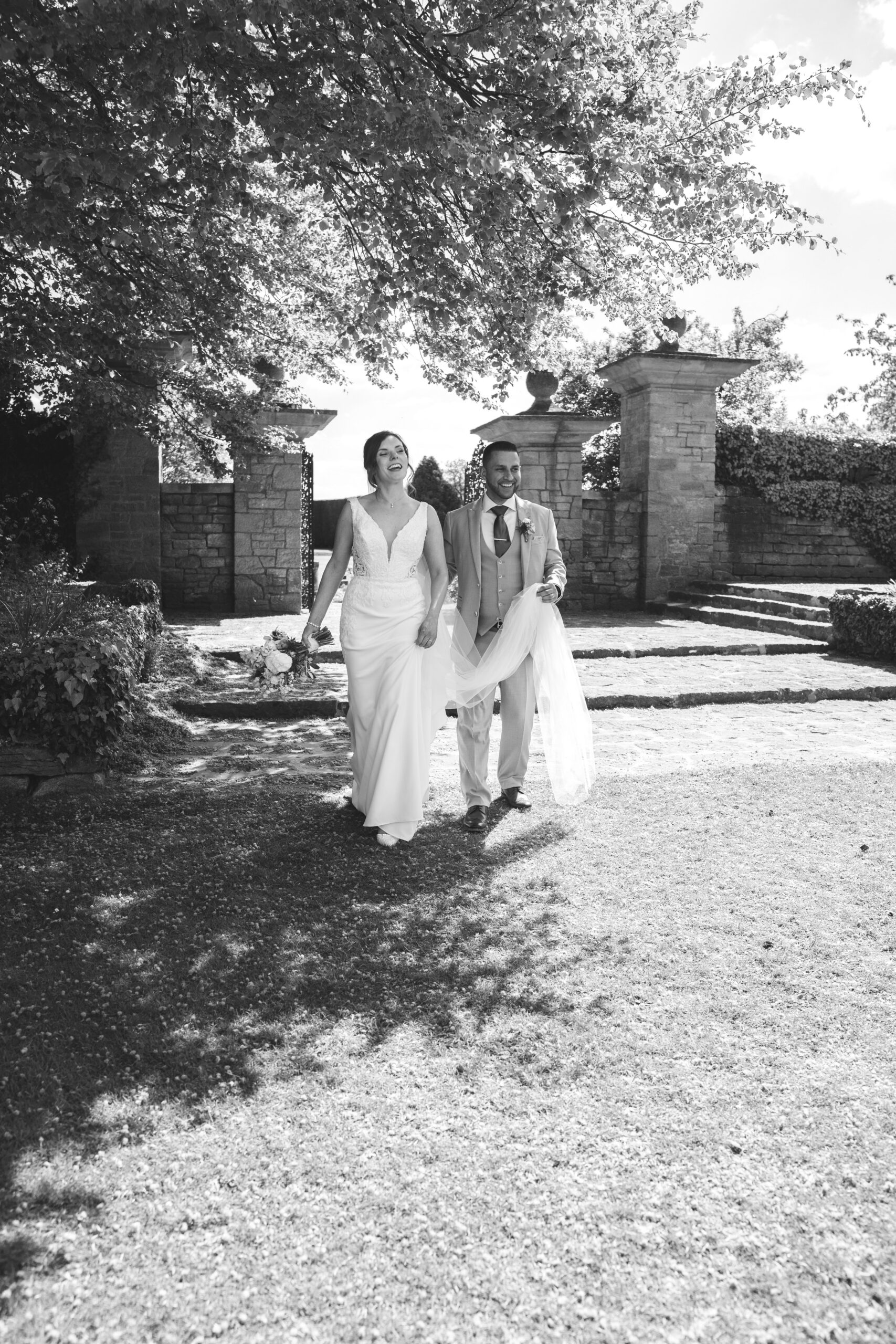 Relaxed couple portrait while walking through private estate gardens in Buckinghamshire.